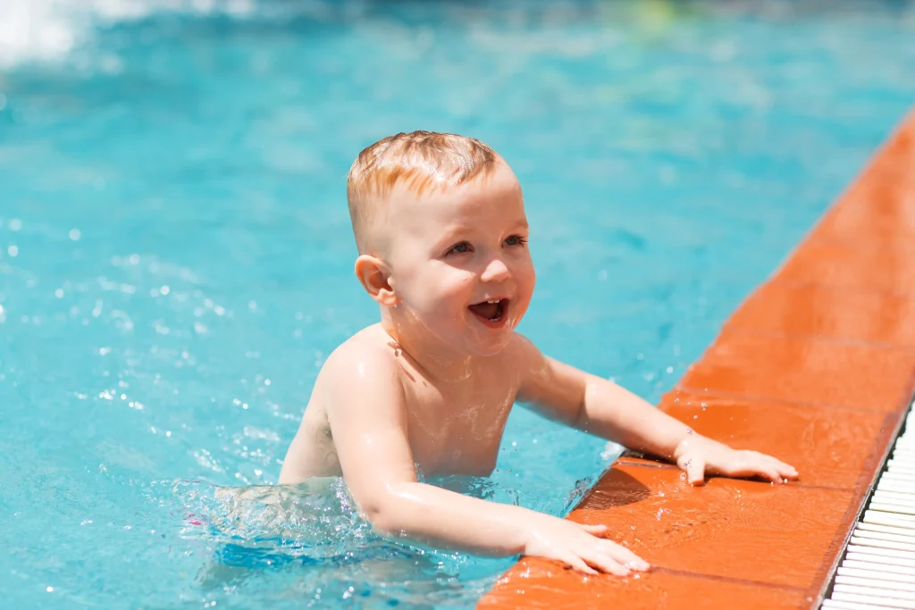 portrait-happy-little-boy-swimming-pool