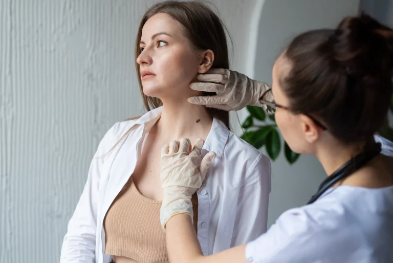 1-female-doctor-diagnosing-melanoma-body-female-patient